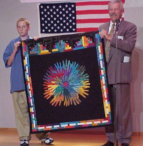 Packie and superintendent Lund present quilt in Otsuchi, Japan