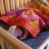 baby sleeping on natural latex crib mattress